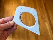 This is the adapter plate made form polypropylene plastic.