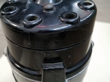 upper cap is crack shown in this pic. 2-piece cap are no longer available new. Regular cap replacement are available new aftermarket.