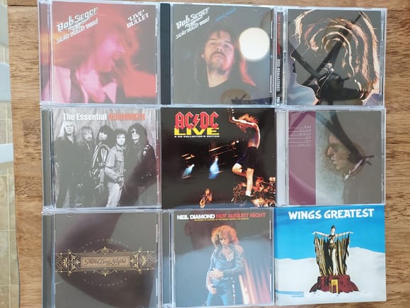 L-R, T-B: Bob Seger, "Live Bullet"; Bob Seger, "Nifht Moves"; Rolling Stones, "Hot Rocks"; Aerosmith, "The Essentials",  AC/DC, "AC/DC Live", Bob Dylan, "Blood on the Tracks";  Three Dog Night, "Greatest Hits"; Neil Diamond,  "Hot August Night"; Paul McCartney and Wings, "Wings Greatest"