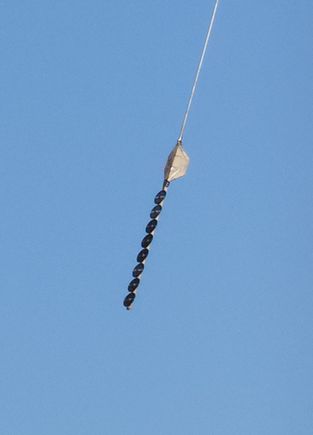 Do any of you guys know what this is?  It's not a UFO, and I will say the top pole is attached to a helicopter.  I didn't know what it was until I did a search for it, so now I know.  I didn't even have a clue that something like this existed!