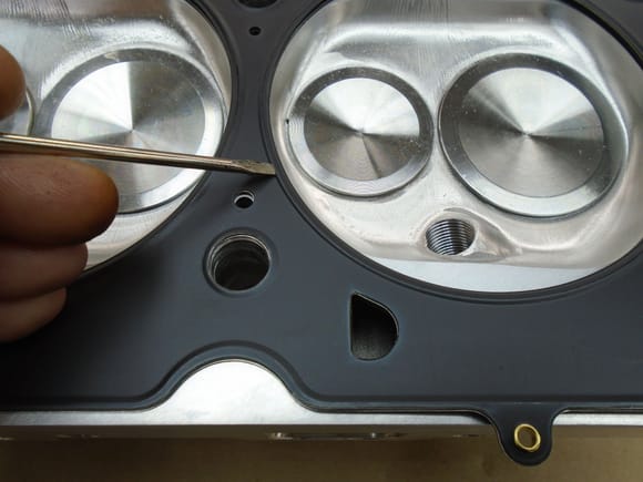 4.200" ID MLS head gasket for 4.125" bore Screwdriver indicating the fire ring / combustion chamber seal