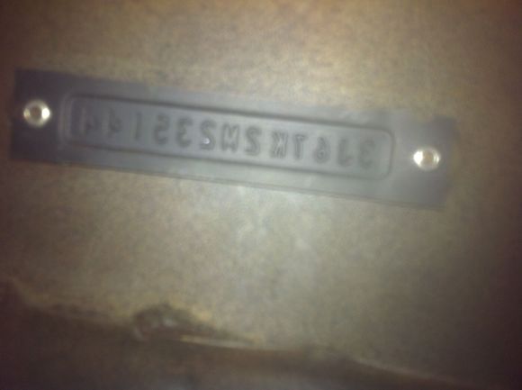 From the bottom under the dash.