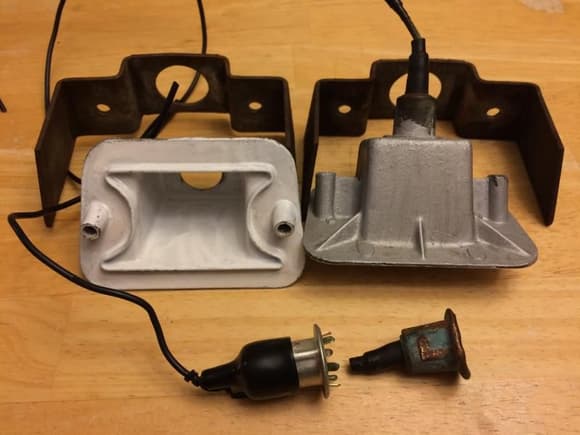 The Reflector on the Right still has the original socket for the 1156 bulb.
The left reflector had the socket ripped out by the body shop.
The silver socket is the $3.00 replacement socket that was later epoxied onto the reflector.
