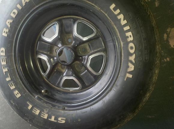 According to my hubby, this spare tire is actually the original.