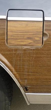 In addition to the non-matching fuel door's deal I have two other questions: 1.) Is there any way to remove--or at least reduce the appearance of--that streaking on the &quot;wood&quot;?; and 2.) Is there anything I can do to arrest the spread of the perforating rust short of an actual &quot;do-over&quot; repair?