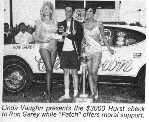 RON GAREY CHESROWN OLDS WINNER OF 68 SPRINGNATIONALS IN A 68 W-31.  FLANKED BY LINDA VAUGHN .