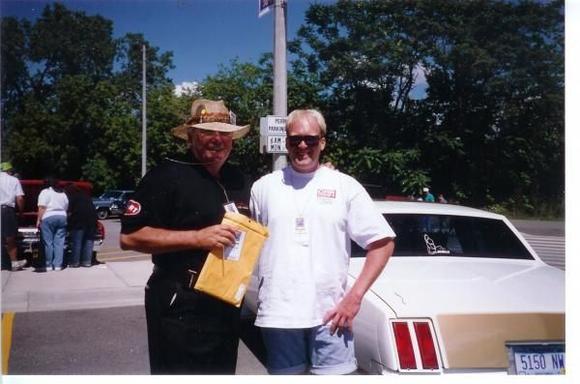 This pic was taken in 1997 at the Oldsmobile Nationals in Lansing Michigan.  This was the first time I met Doc Watson, he also signed my trunk, on my Olds that is.