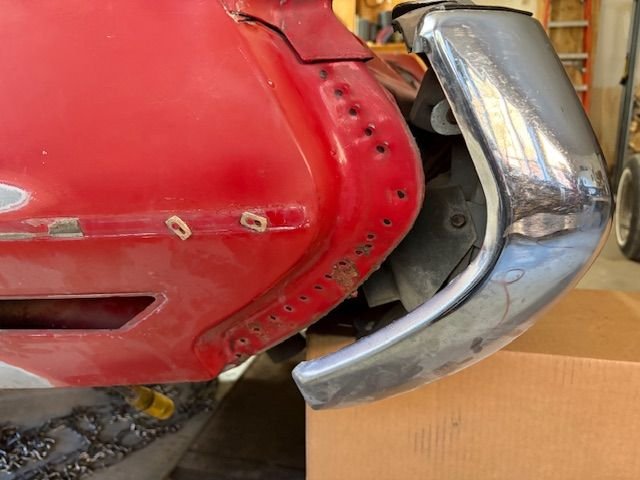 Loosened bumper and pushed it back.  Should have just taken it off right away.  Spot welds marked