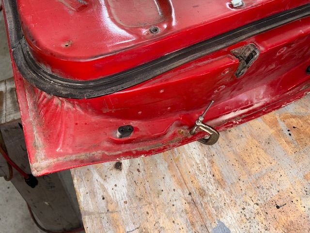 While at it with the welder, I filled two holes, one on each end of the door where beltline stainless steel moldings attach.  I don’t like em and will not use them.  Here I have reamed the hole to remove rust, and clamped a copper backer.  Hole size is 3/8”