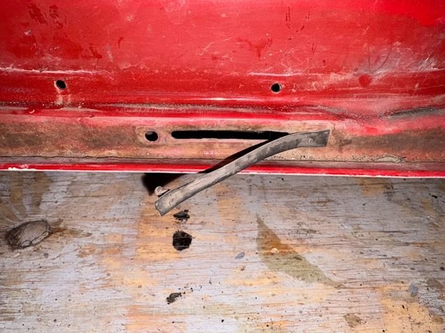 These little short door bottom seals were still in remarkably good condition.  Looks like the design intent is to allow internal rainwater to get out, but prevent dust from going back up into the door
