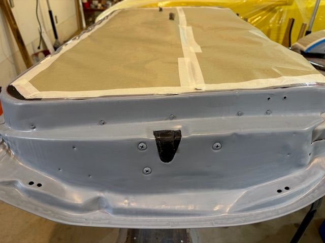 Door seal holes blocked with small wood dowels to prevent getting red on the glass.  Latch is masked off