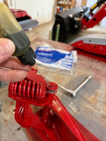 Oiling up the roller.  There is such tremendous force on all the parts due to the high spring force.   I wore not only safety glasses but also a full face shield.  The spring came out of the tool once, and I am happy it went away from me rather than toward me.