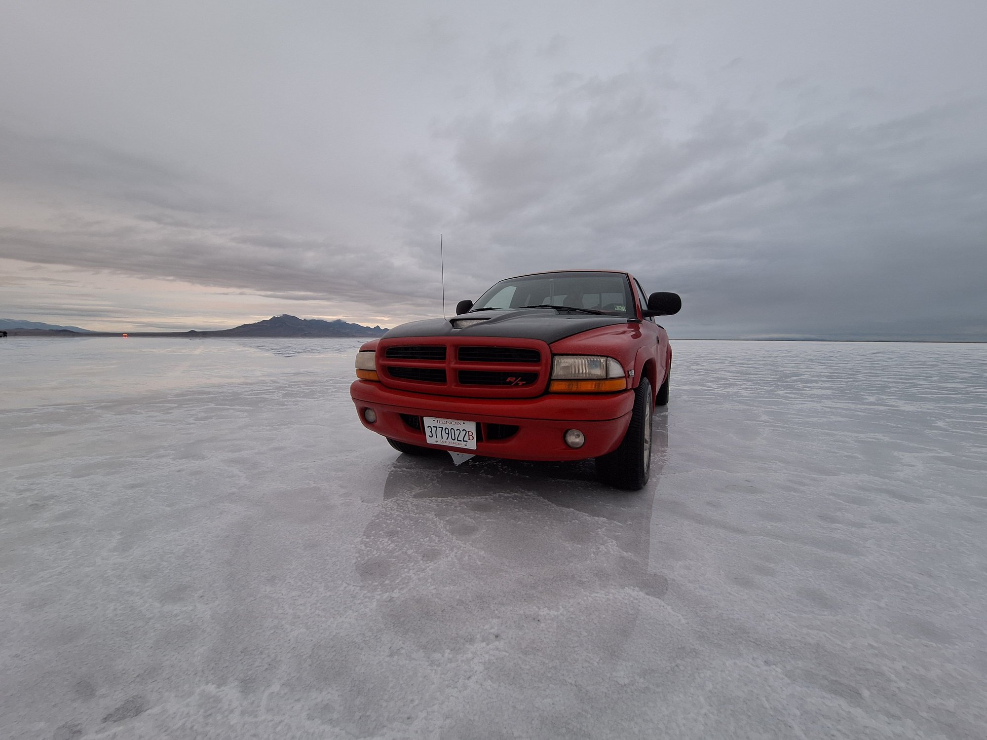 Bonneville salt flats ....99 Dakota R/T ....roller rockers ,cam,oil pump valve job mild port polish gasket match ,aftermarket throttle body , injectors, coil,relocated the battery,now fully functional carbon fiber hood ,custom transmission, i recently installed leather R/T seats ,275 55 rear tires ,roll pan ....i can go on and on....i have a custom 92 ext cab ,and a copper fire colored 2000 reg cab R/T i bought the bed for this truck in Vancouver Wa,the fenders in Texas the hood in Illinois ....
