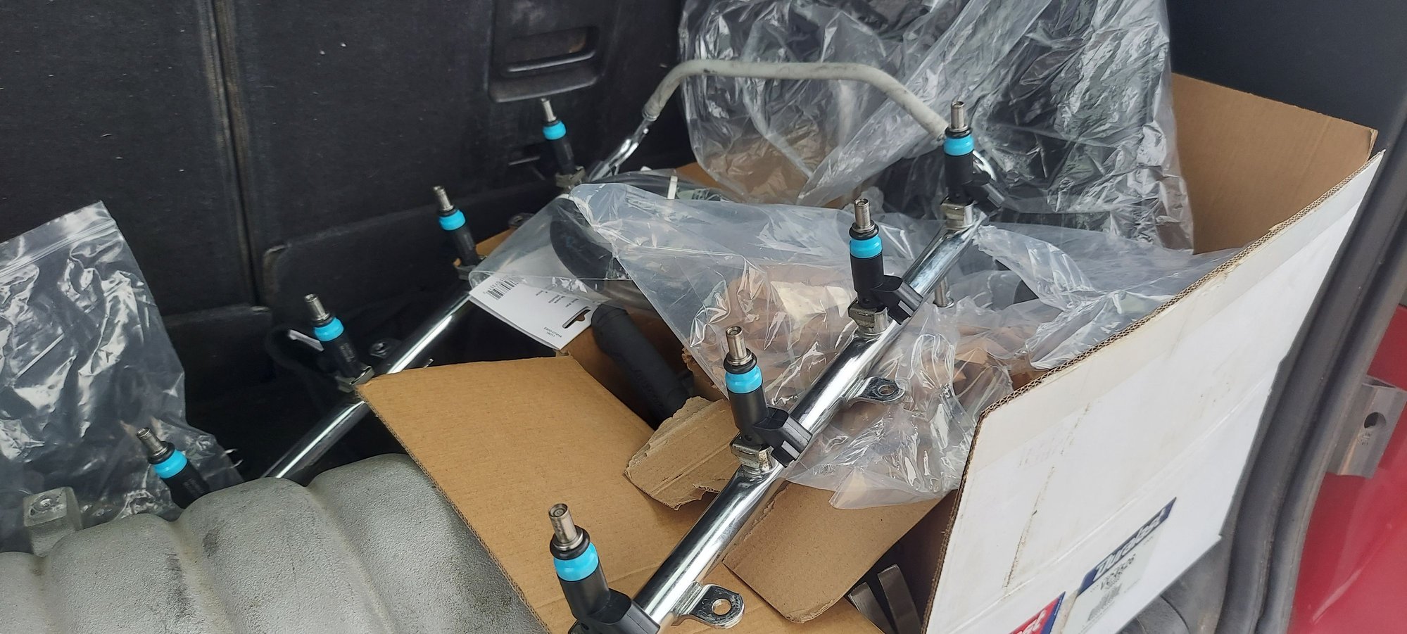 These injectors are for a 2012 Jeep Grand Cherokee SRT8 according to amazon....  They are the same size and shape as the orange capped stock units.  I got P0172/P0175 with the plastic manifold.  