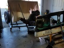 NO RAIN TODAY!. I pushed it out, and got the suspensions off. Here we are using the welding blanket to block the wind. It has been a crazy start of the year for weather. 