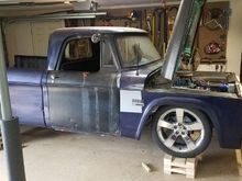 On the new stands. The hood barely misses the ceiling when open. 