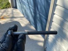 Thanks for all the responses so far.  Based on Kieth_Al’s comments, I pulled the bolt and inspected. No evidence of any thread lock compound.  Threads showed no signs of galling or any other damage. 

Looked up specs for the bolt - it’s supposed to be (according to a Mopar OEM parts site) .375-16, 4.25 inches long.  Measuring and pitch check confirmed it’s the correct bolt. 

