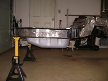 It doesnt hang down too much. Its about even with the tow hitch/jack point. 