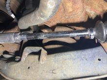 Bump stop fits into socket behind tie rod.  