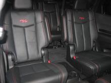 View of captains chairs from front passenger seat.
