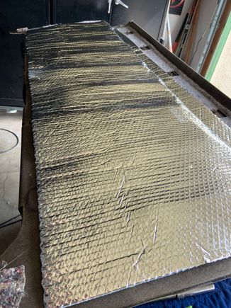 Used some attic Insulation from Home Depot and 3M adhesive spray to add a better heat barrier to the rear panel.