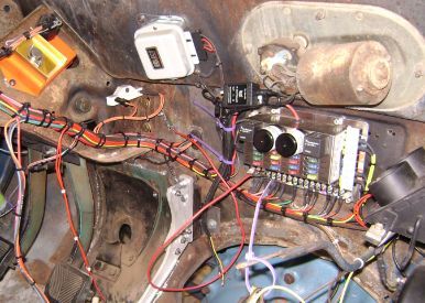 This side is a little better. Ignore the big red wire. That is me finding out Im an idiot and didnt ground the starter relay. Oops. 