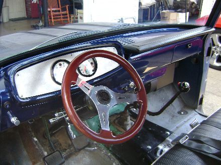Look past the steering wheel. Its going to go. I hate it. It looks cheap, and blocks the gauges. 