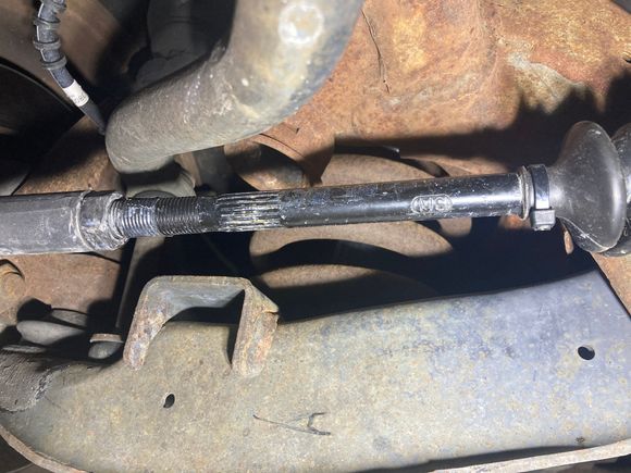 Bump stop fits into socket behind tie rod.  