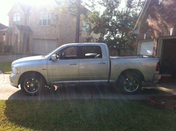 I have stock chrome 20"s on it now, but am looking to put these black rims back on it.
