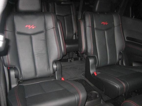 View of captains chairs from front passenger seat.