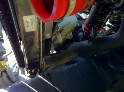 A shot from under the truck with my modified intake.  I chose to end it here due to all the Seattle rain.  I had another piece running in front but it kept getting wet.  Once I cut it back to here it's been nice and dry.