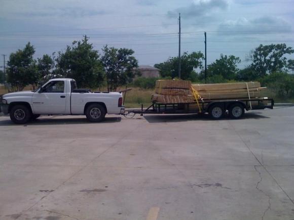 Towing 8,000lbs of timber loaded on a 16ft flat bed. Don't be fooled, this truck can pull, and stop! That is a V6!