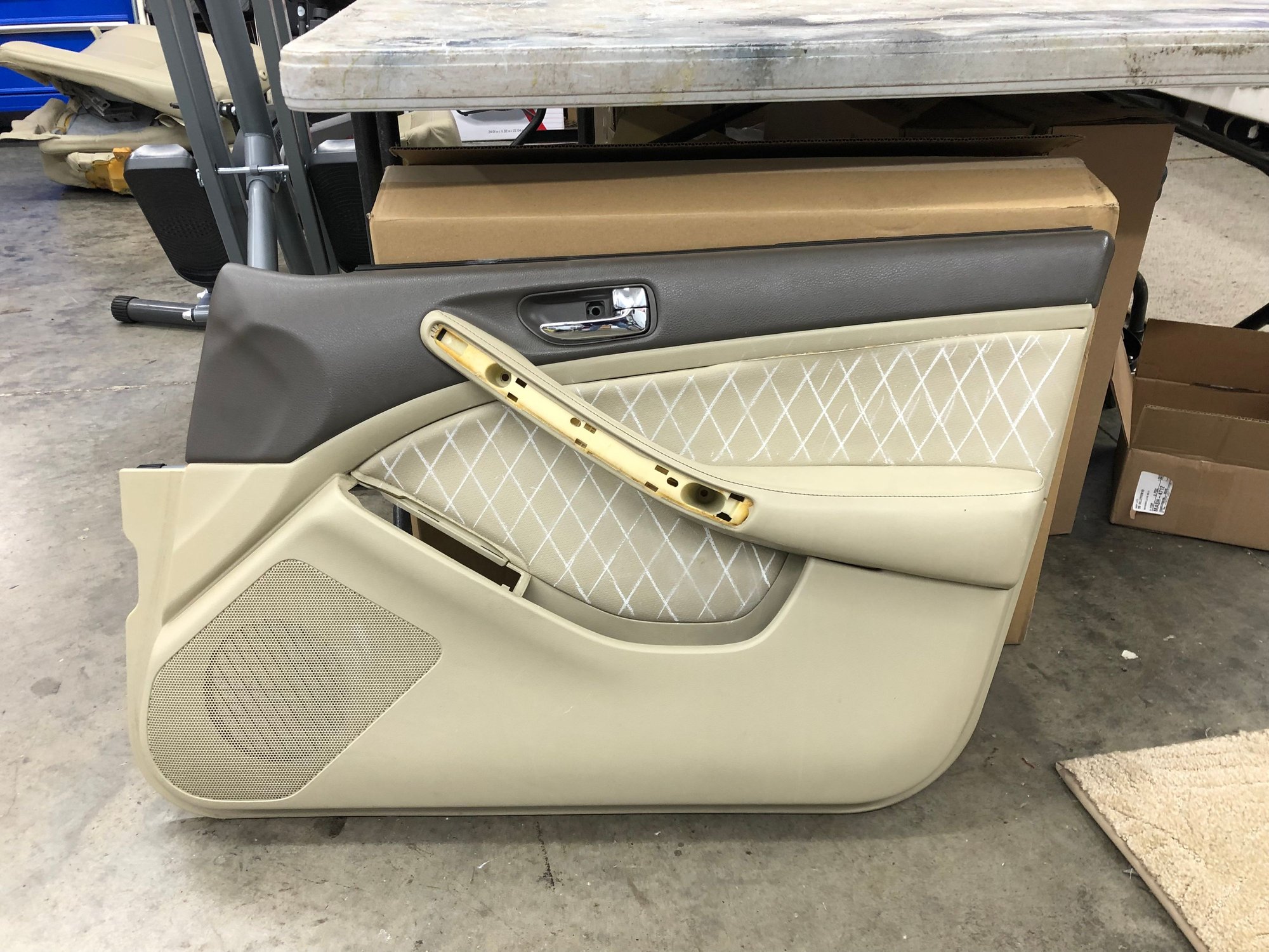 The door panel getting drawn out for stitching 