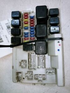 This is exactly what my fuse box looks like and the clicking stops when I remove the small relay in the middle. That is ignition and the car starts fine. With this removed I still get clicking when trying to turn the headlights on.