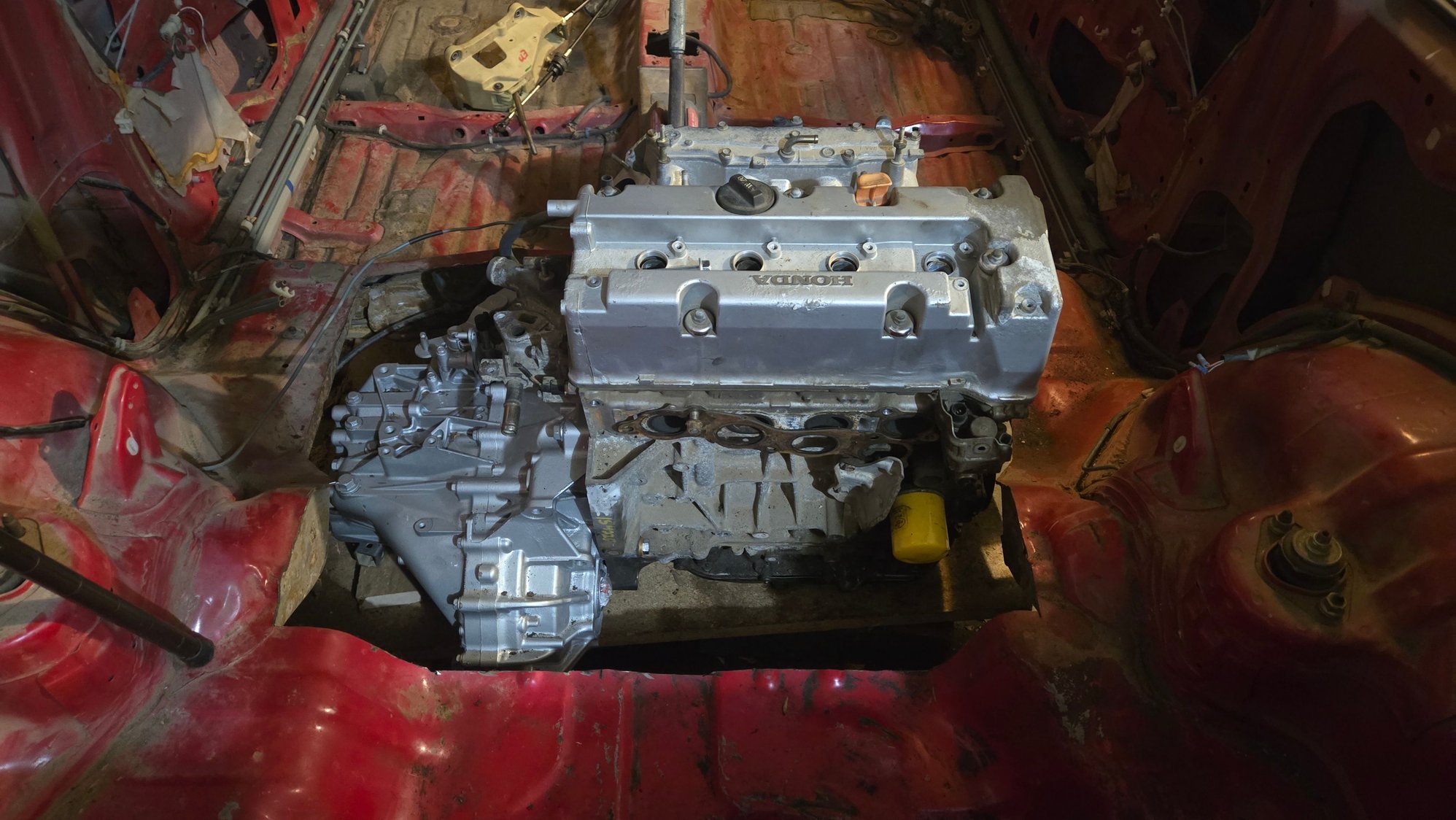 Axle location is just ahead of rear crossmember, similar to rear diff axle location for AWD swaps.