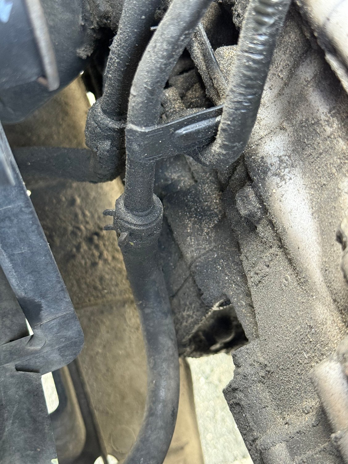 Here you can see a bit, the two transmission cooler lines the close one is a lot cleaner than the other