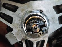 That small line on the left of the center shaft. I put the copper part of the distributor rotor on the same side of the line if you know what i mean