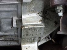 looks like an A or a 4 stamped above the block. Also I believe this is the same area I should be looking for the trans stamp and there is nothing else there just a blank space