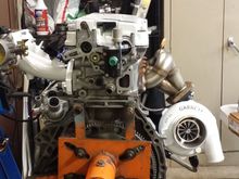 From the side, you can see how runners 1 & 4 have a slight additional bend in them to allow the turbocharger to sit a bit higher for better drain flow 