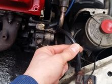 This wire is right next to the driver side headlight and connects between the engine itself and the frame above the headlight. Can't miss it.