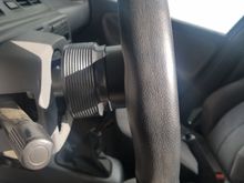 1 inch hub spacer. Having it a tad closer to me is nice cuz i sit ao far back. Cheap mod that made a big difference.