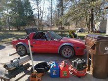 Clearing out the garage to clean the floor after the thermostat replacement.  A bit of coolant on the ground.