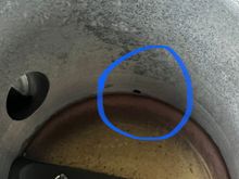 There is a small hose that connects to that pin hole. 