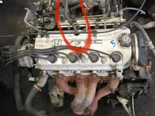 This wire circled is missing. I’m not in front of the car now but found a pic of the same engine.