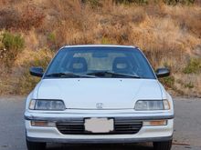 has some minor blemishes - bumper crinkle on passenger side, and small dent/depression in hood near logo