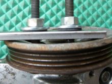 You can't see it, but there are washers and rubber washers on the other side of the pulley, too.