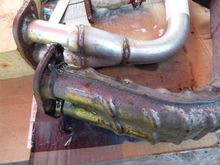 The factory exhaust (24 years old) has light surface rust, but never used Bosal is rusting at the welds and flange.