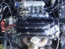 custom painted valve cover, shaved n professionally sprayed blk, sealed the deal with the infamous "boost get's yo laid" decal