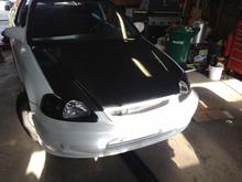 Carbon fibre hood and black housing headlights with HID's. 
Just put them on to see how it looked, however it will be coming off when I pull the motor.