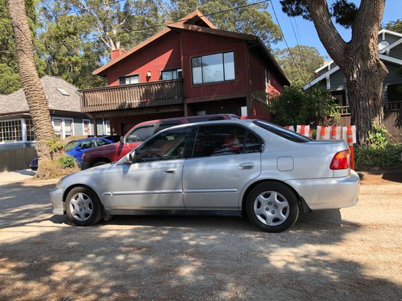 My K-swapped 99 sedan.  Koni Orange & Tein H-techs for optimal ride comfort plus spring spacers for max oil pan ground clearance.  Old tint removed and re-tinted.  Oem lip and stock (EX) hubcaps